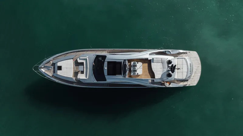 Alexandra Yacht Photos Pics Aerial view of 2020 Pershing 8X luxury yacht on calm green water.