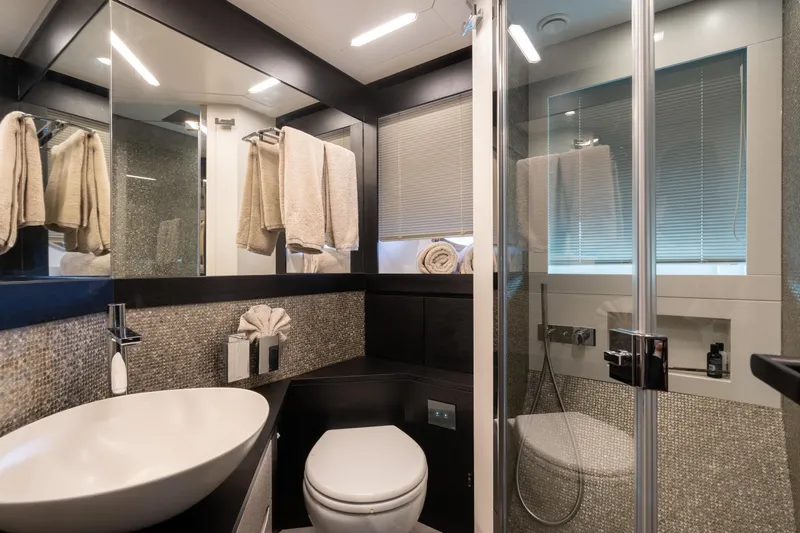 Alexandra Yacht Photos Pics Luxurious bathroom in 2020 Pershing 8X yacht with modern fixtures and elegant design.