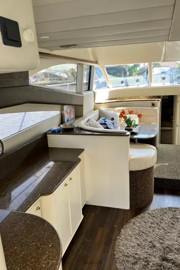 Sea Jeanie Yacht Photos Pics Interior of 1999 Viking Princess 52 Express Bridge yacht with modern furnishings and large windows.