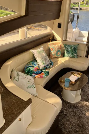 Sea Jeanie Yacht Photos Pics Luxurious interior of 1999 Viking Princess 52 Express Bridge with plush seating and decorative pillows.