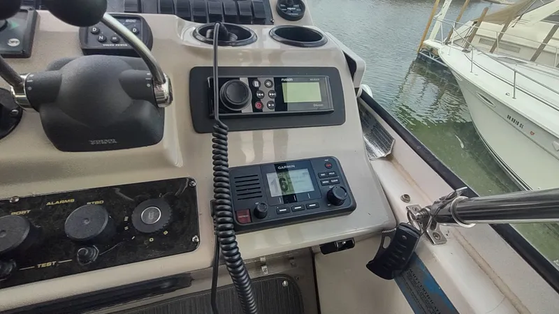  Yacht Photos Pics Control panel of a 2001 Cruisers Yachts 4450 Express Motoryacht with navigation equipment.