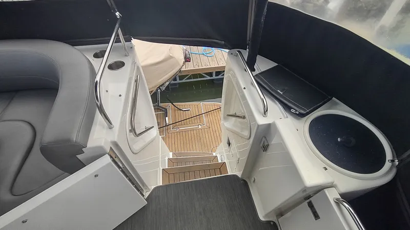  Yacht Photos Pics 2001 Cruisers Yachts 4450 Express Motoryacht interior with seating and steps to deck.