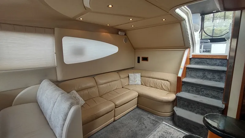  Yacht Photos Pics Luxurious interior of 2001 Cruisers Yachts 4450 Express Motoryacht with beige leather seating.