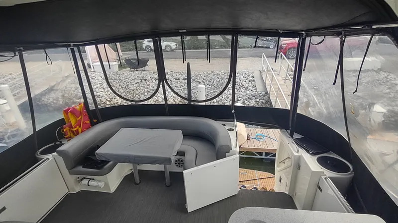  Yacht Photos Pics 2001 Cruisers Yachts 4450 Express Motoryacht interior with seating and table, docked at marina.