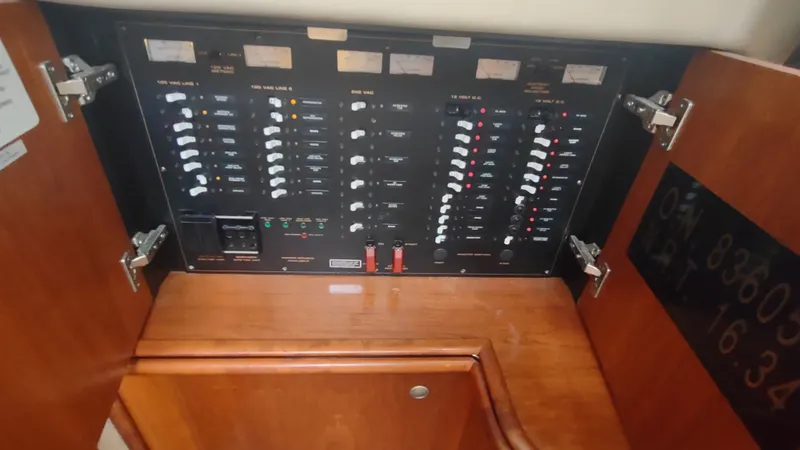  Yacht Photos Pics Electrical panel inside 2001 Cruisers Yachts 4450 Express Motoryacht, featuring switches and meters.