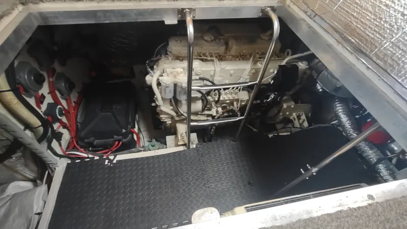  Yacht Photos Pics Engine room of 2001 Cruisers Yachts 4450 Express Motoryacht with visible machinery and components.