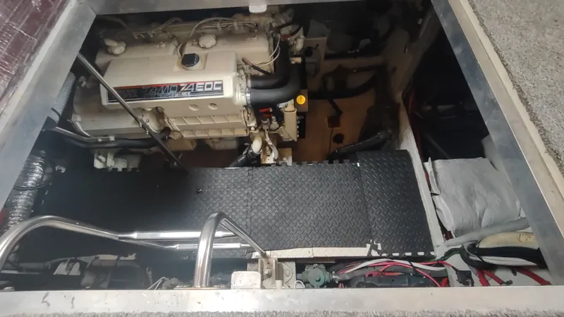  Yacht Photos Pics Engine compartment of 2001 Cruisers Yachts 4450 Express Motoryacht, showcasing detailed machinery.