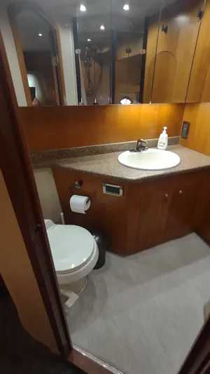  Yacht Photos Pics Bathroom interior of 2001 Cruisers Yachts 4450 Express Motoryacht with sink and toilet.