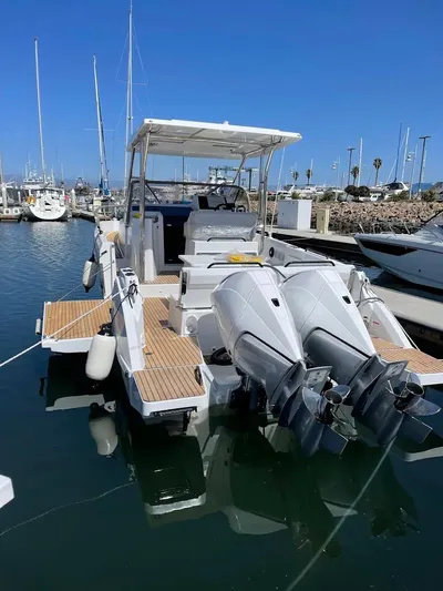  Yacht Photos Pics 2024 Beneteau Flyer 9 SUNdeck boat docked with dual outboard engines.