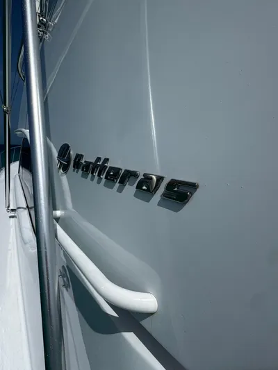  Yacht Photos Pics Hatteras 50 Convertible yacht, 2005 model, close-up of logo and railing.