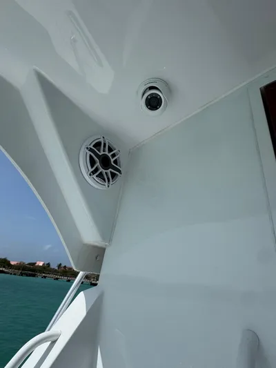  Yacht Photos Pics 2005 Hatteras 50 Convertible yacht with speaker and camera on deck.