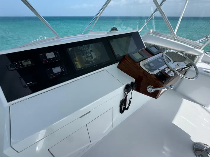  Yacht Photos Pics Helm of 2005 Hatteras 50 Convertible yacht with ocean view.