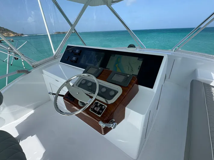  Yacht Photos Pics Helm of 2005 Hatteras 50 Convertible yacht with ocean view.