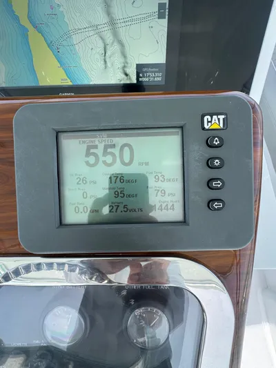  Yacht Photos Pics Close-up of a CAT engine display on a 2005 Hatteras 50 Convertible yacht.