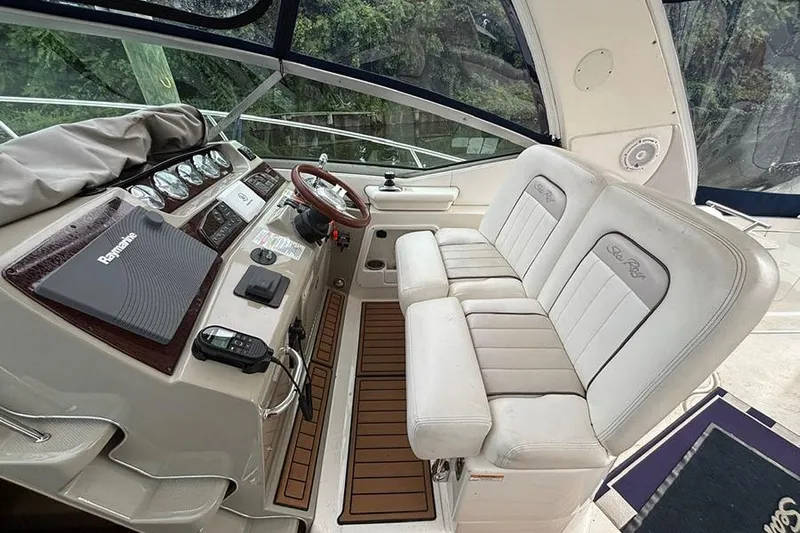  Yacht Photos Pics Interior of a 2011 Sea Ray 370 Sundancer boat with helm and seating area.