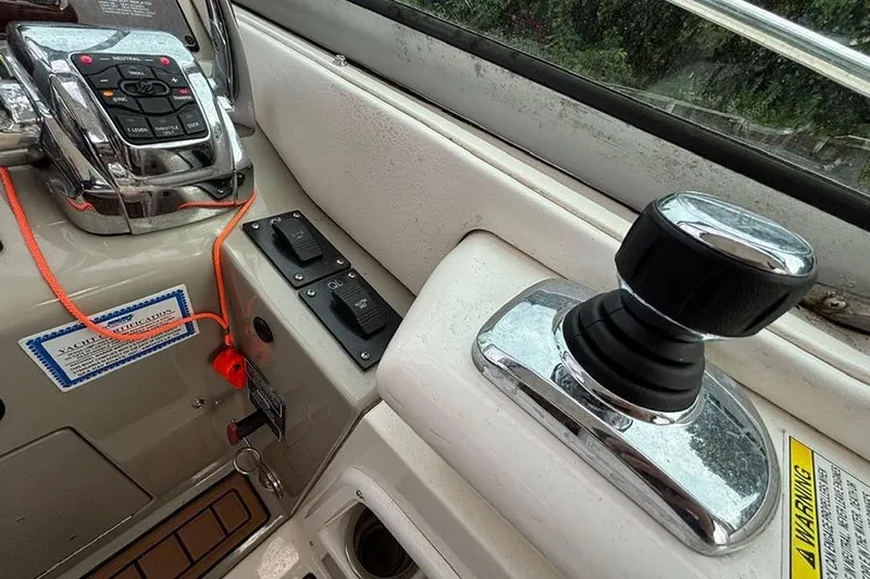  Yacht Photos Pics Control panel of a 2011 Sea Ray 370 Sundancer boat with joystick and switches.