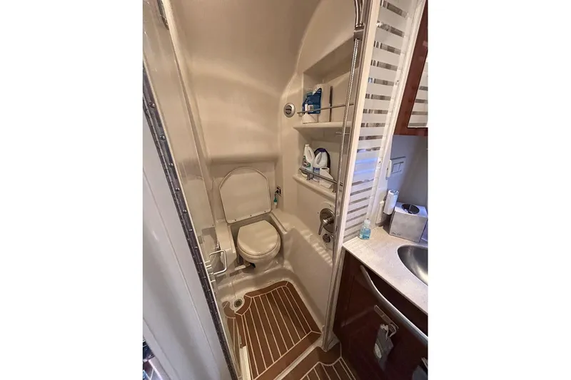  Yacht Photos Pics Bathroom interior of 2011 Sea Ray 370 Sundancer yacht, featuring compact design and amenities.