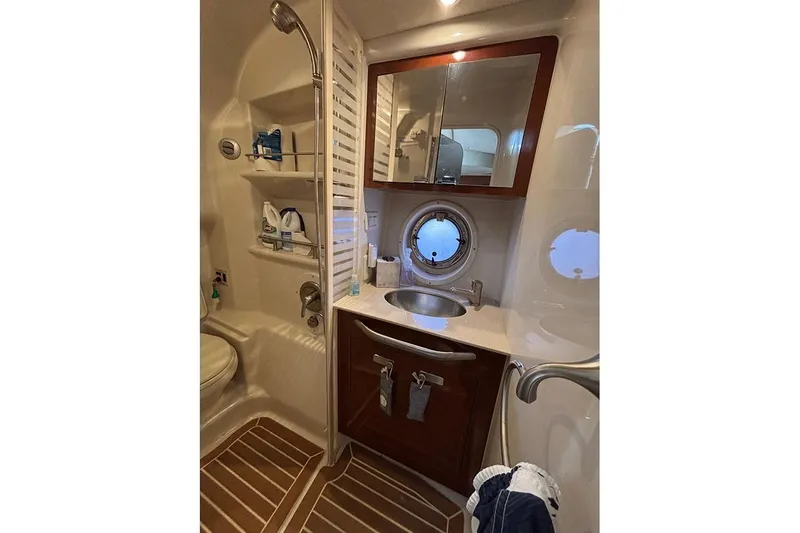  Yacht Photos Pics Luxurious bathroom in 2011 Sea Ray 370 Sundancer yacht with modern amenities.