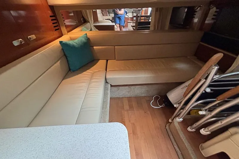  Yacht Photos Pics Interior of 2011 Sea Ray 370 Sundancer with beige seating and wooden flooring.