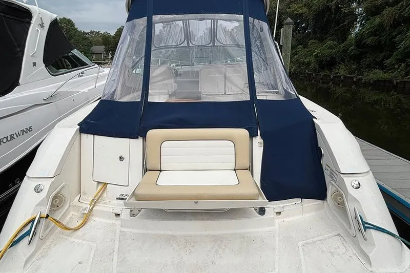  Yacht Photos Pics 2011 Sea Ray 370 Sundancer boat docked, featuring a covered seating area.
