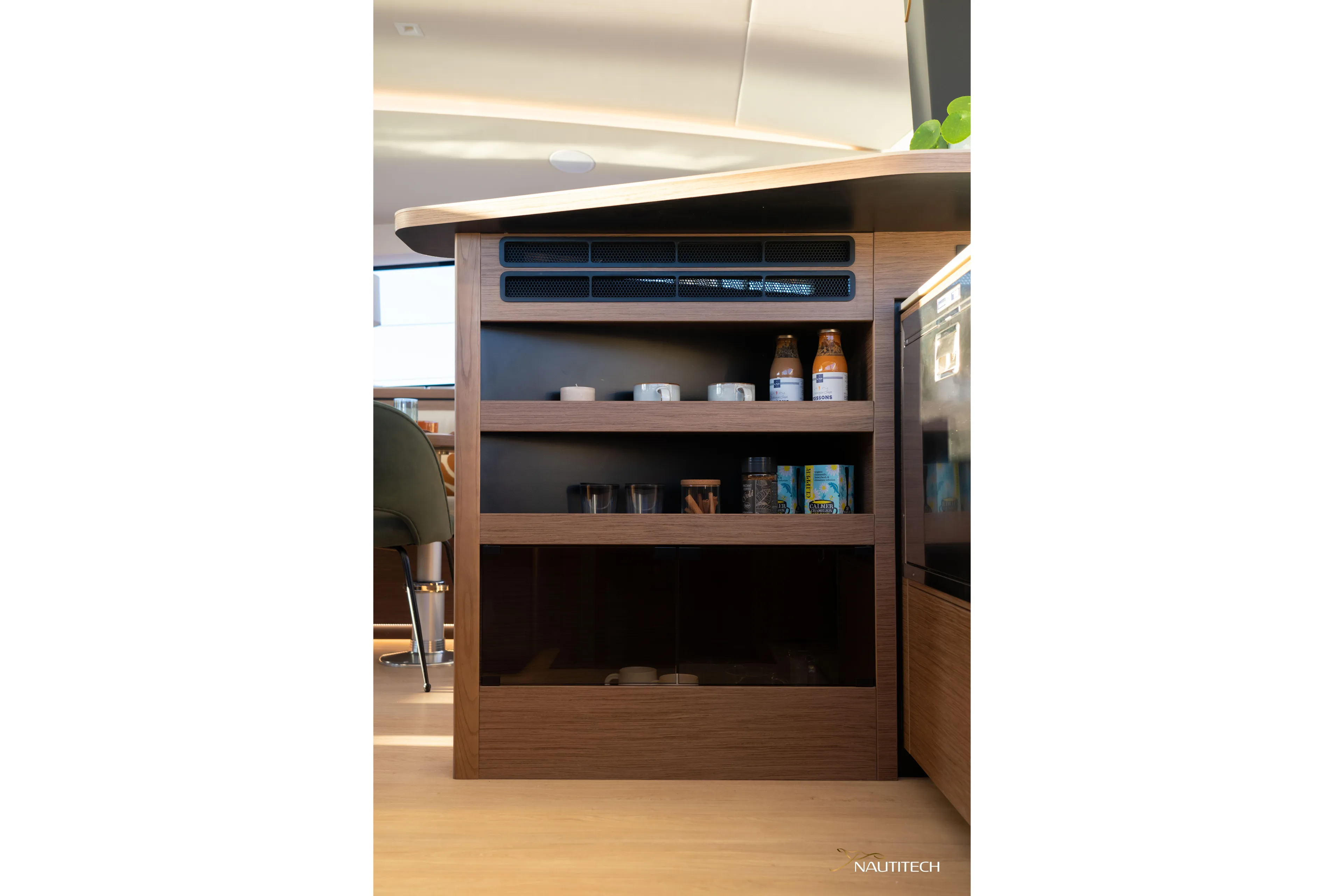 Nautitech 48 Open - Available For 2026 Delivery! Yacht Photos Pics Modern kitchen storage in Nautitech 48 Open (2025) yacht, featuring wooden shelves and beverages.