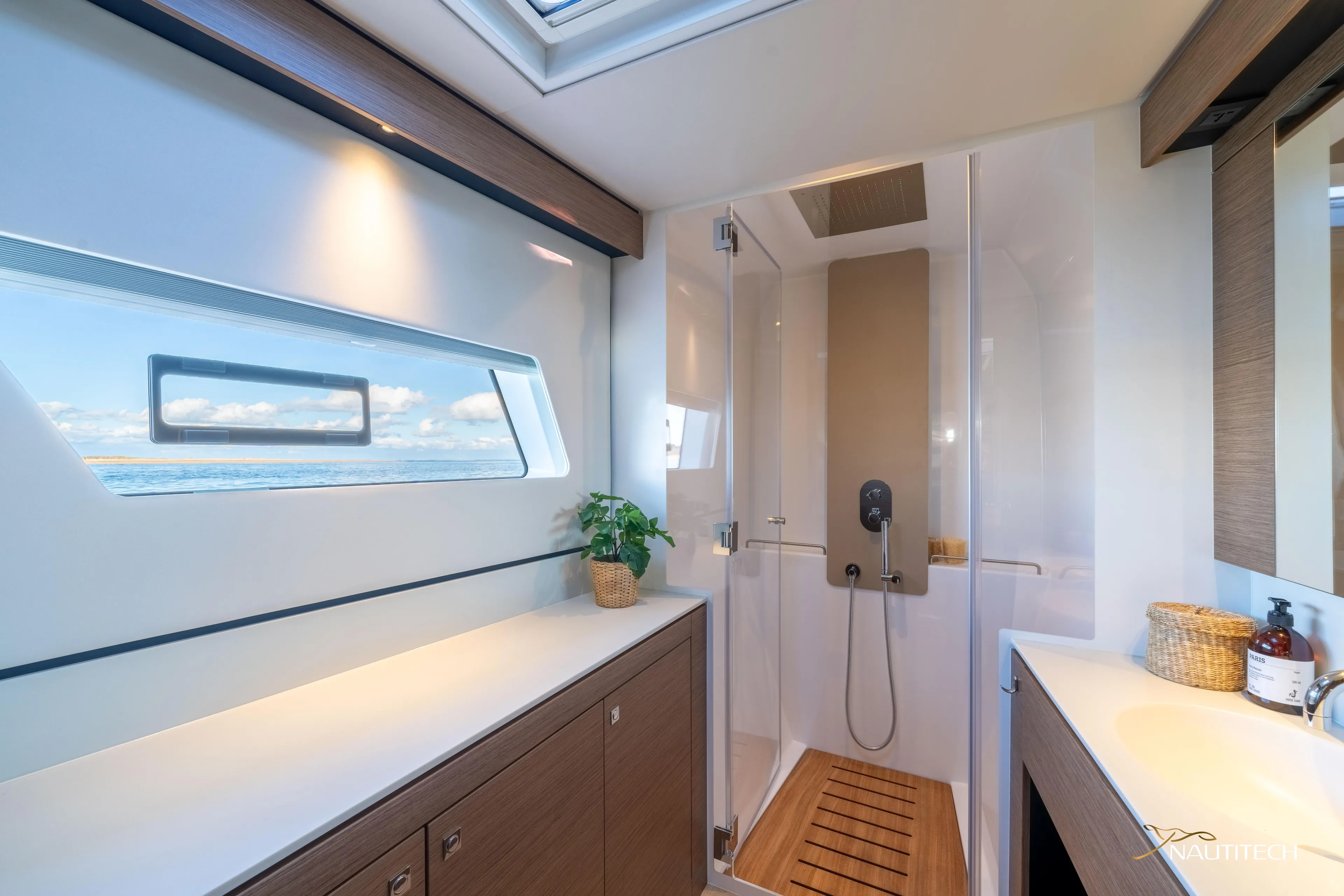 Nautitech 48 Open - Available For 2026 Delivery! Yacht Photos Pics Luxurious bathroom interior of Nautitech 48 Open yacht, featuring modern design and ocean view.