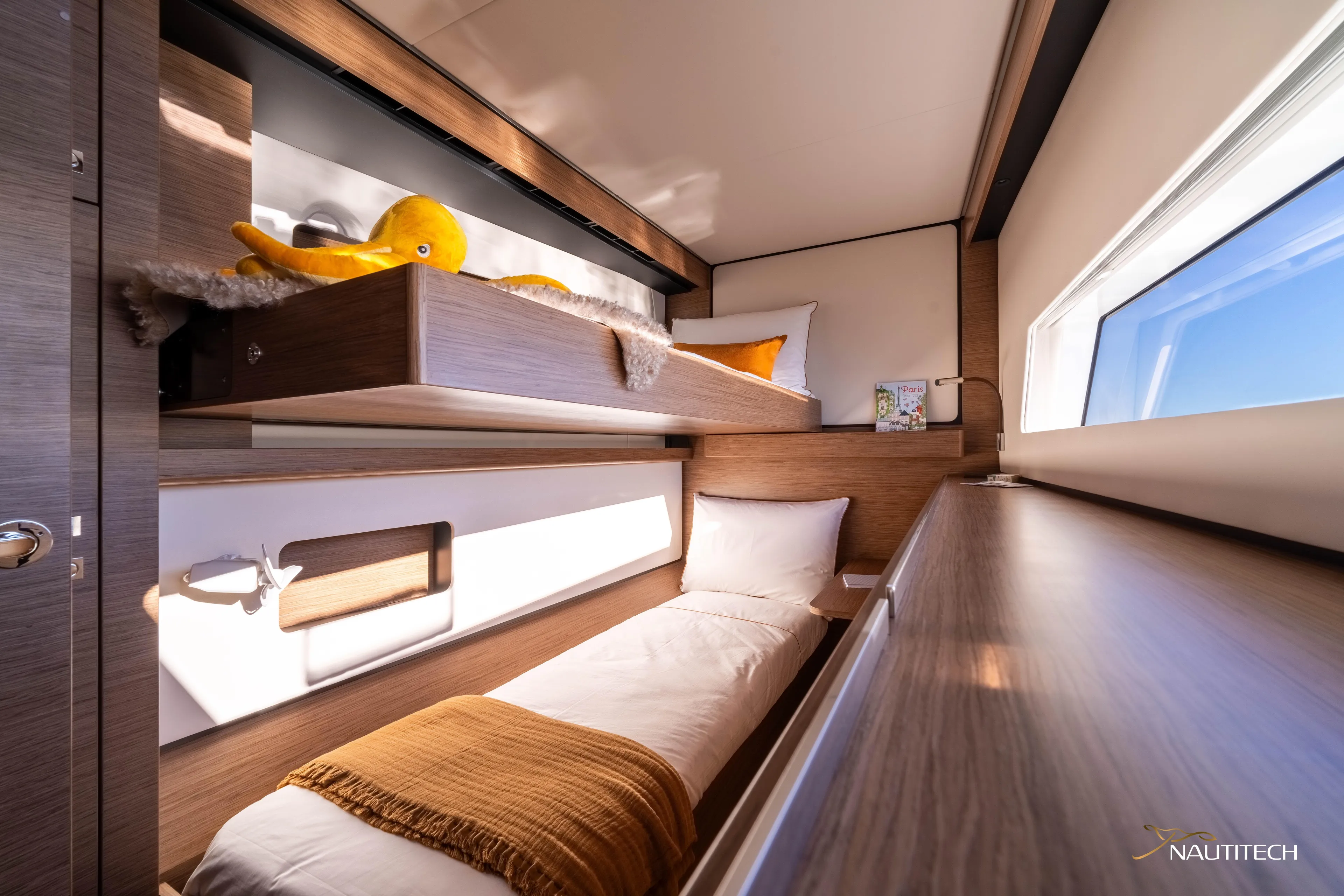 Nautitech 48 Open - Available For 2026 Delivery! Yacht Photos Pics Luxurious Nautitech 48 Open 2026 yacht cabin with cozy bunk beds and modern design.