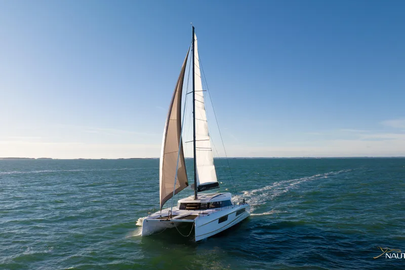 Nautitech 48 Open - Available For 2026 Delivery! Yacht Photos Pics Sailing catamaran Nautitech 48 Open (2025) gliding on open sea, 2026 model.