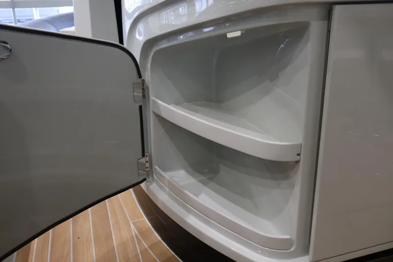  Yacht Photos Pics Open storage compartment on SACS 13, 2026 model, with two shelves and sleek design.
