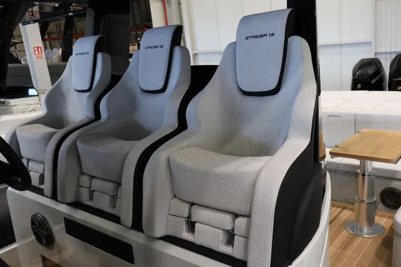  Yacht Photos Pics 2026 SACS Strider 13 boat seats, modern design, luxurious interior, light gray upholstery.