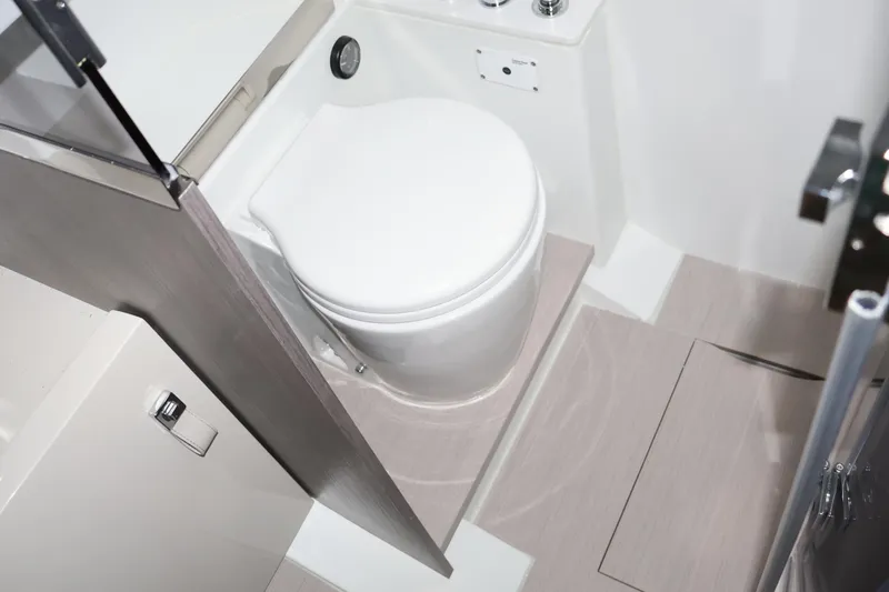  Yacht Photos Pics Modern bathroom interior in 2026 SACS 13 model boat, featuring sleek design and compact toilet.