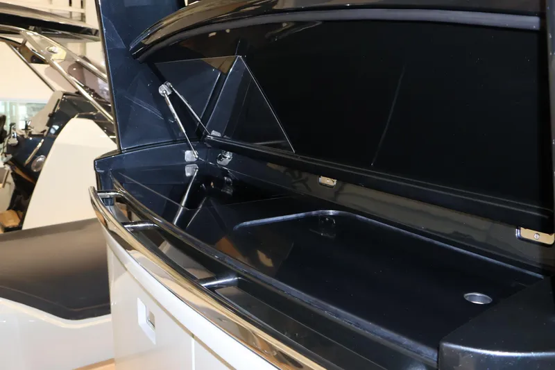  Yacht Photos Pics 2026 SACS 13 boat interior storage compartment with sleek black finish.