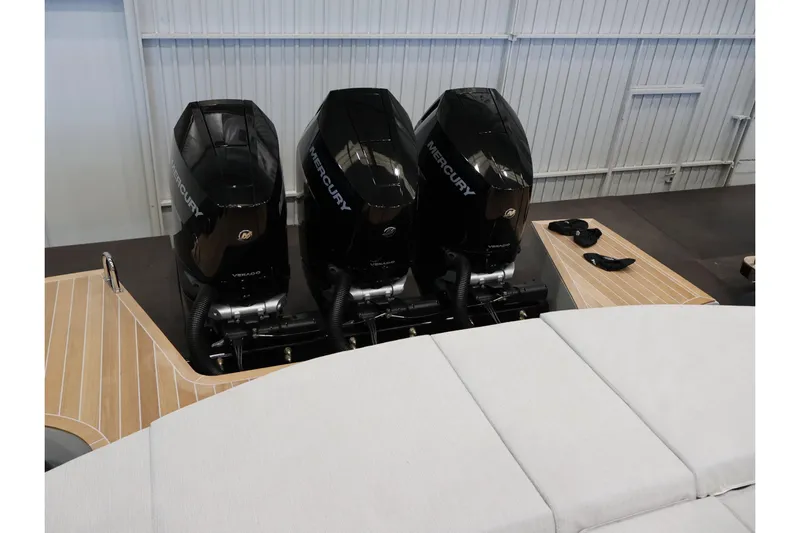  Yacht Photos Pics Triple Mercury outboard engines on 2026 SACS 13 boat in a showroom.