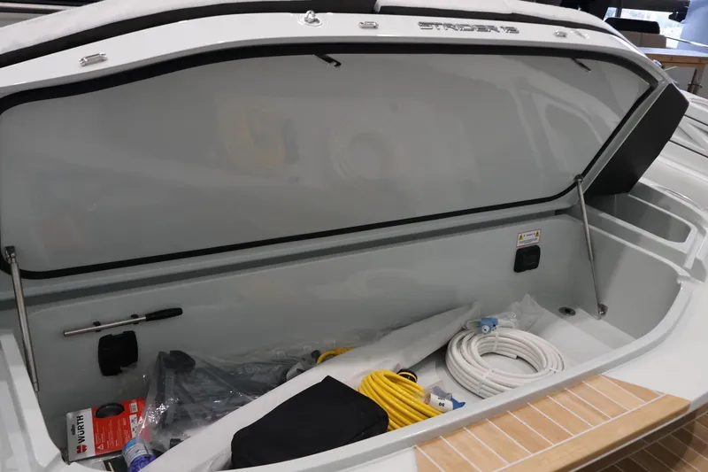 Yacht Photos Pics Open storage compartment of 2026 SACS 13 boat with various equipment inside.