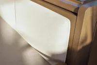 Interior detail of Nautitech 48 Open (2025) yacht, showcasing elegant wood and fabric design.