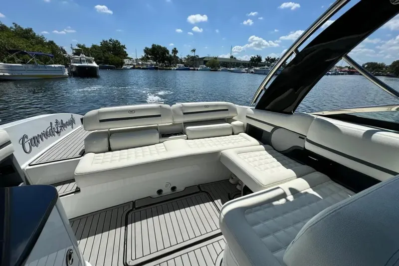  Yacht Photos Pics 2020 Cobalt R30 boat interior with white seating on a sunny day.