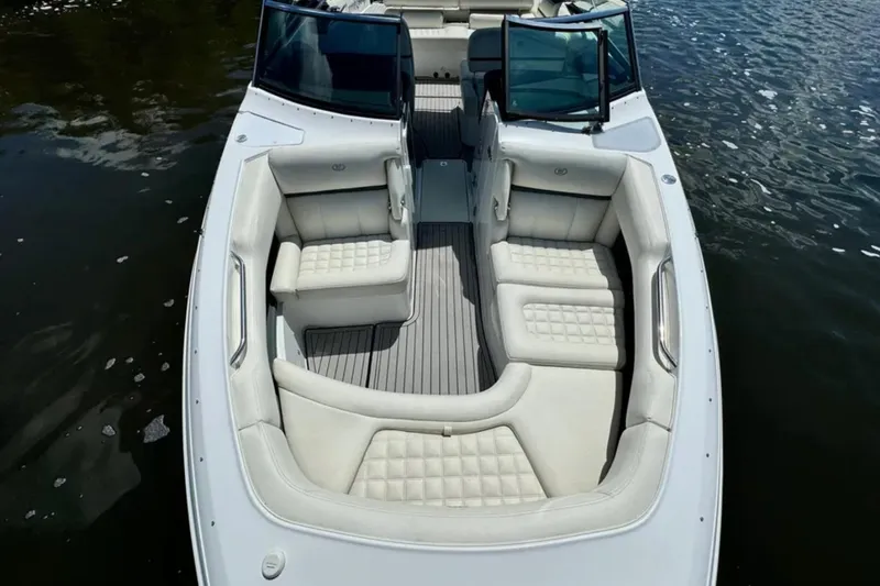  Yacht Photos Pics 2020 Cobalt R30 boat with luxurious white seating on calm water.
