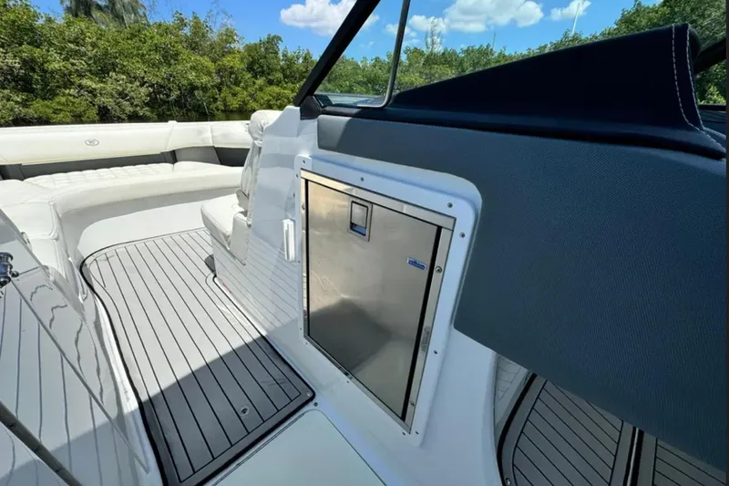  Yacht Photos Pics 2020 Cobalt R30 boat interior with seating and stainless steel compartment.
