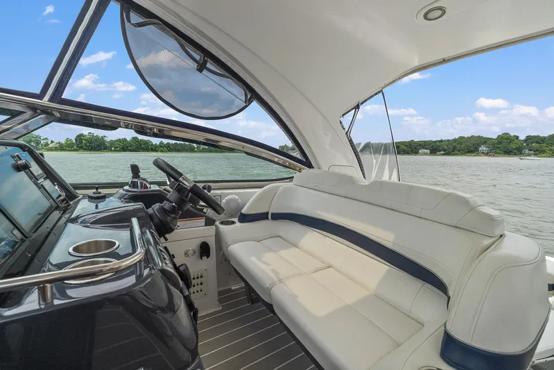  Yacht Photos Pics Interior of a 2020 Formula 37 PC yacht with white seating and helm.