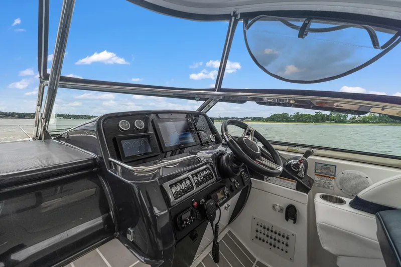  Yacht Photos Pics 2020 Formula 37 PC yacht helm with advanced navigation systems and scenic water view.