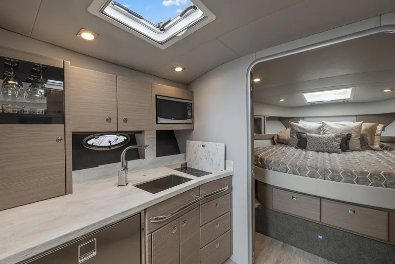  Yacht Photos Pics Modern interior of 2020 Formula 37 PC yacht with kitchen and cozy bedroom.
