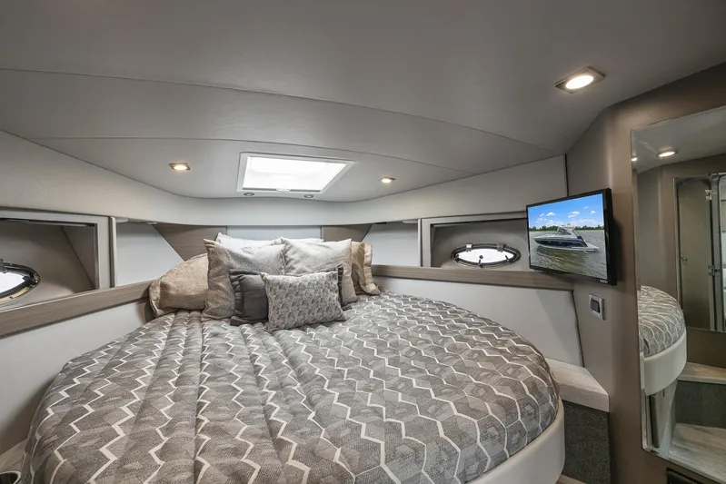  Yacht Photos Pics Luxurious bedroom interior of 2020 Formula 37 PC yacht with skylight and TV.