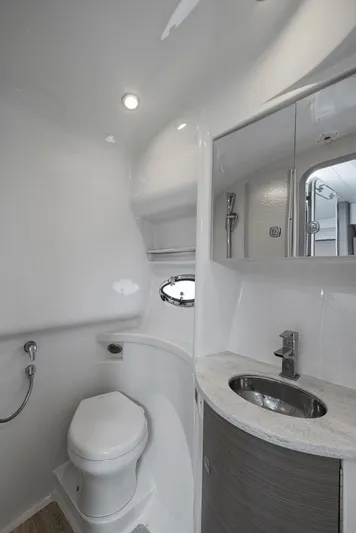  Yacht Photos Pics Modern bathroom in 2020 Formula 37 PC yacht with toilet, sink, and shower.