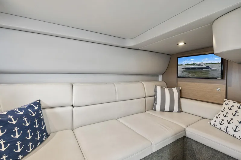  Yacht Photos Pics Luxurious interior of 2020 Formula 37 PC yacht with plush seating and nautical-themed pillows.