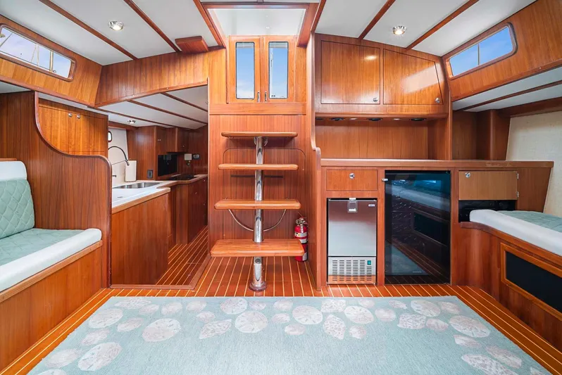 Best Revenge Yacht Photos Pics Interior of 1981 Pearson 530 yacht with wooden cabinetry and modern amenities.