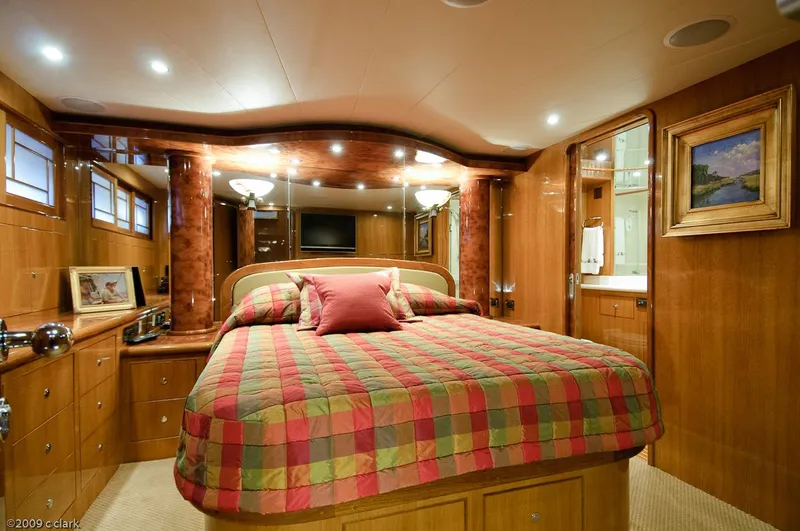 Momentum III Yacht Photos Pics Luxurious bedroom interior of 2005 Ocean Alexander 58 Motoryacht with elegant wood finishes.