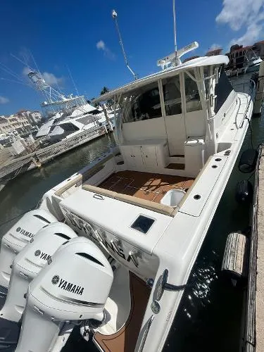 No Name Yacht Photos Pics 2019 Pursuit OS 385 Offshore boat docked with Yamaha engines, clear sky background.