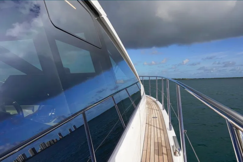  Yacht Photos Pics Azimut S6 Sports Fly 2021 yacht cruising on open water under cloudy skies.