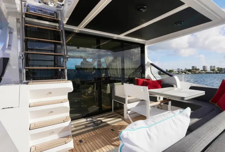  Yacht Photos Pics Luxurious 2021 Azimut S6 Sports Fly yacht deck with seating and ocean view.