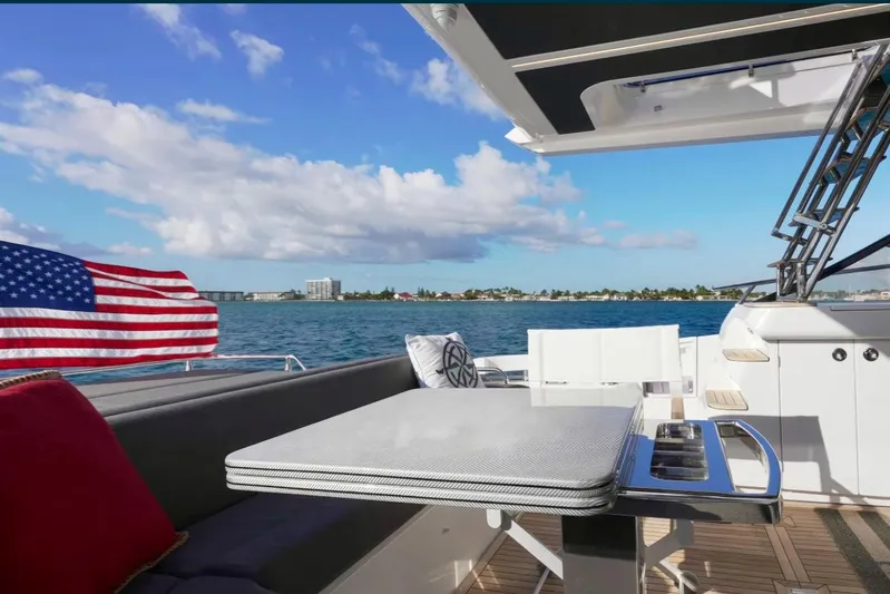  Yacht Photos Pics Azimut S6 Sports Fly 2021 yacht deck with ocean view and American flag.